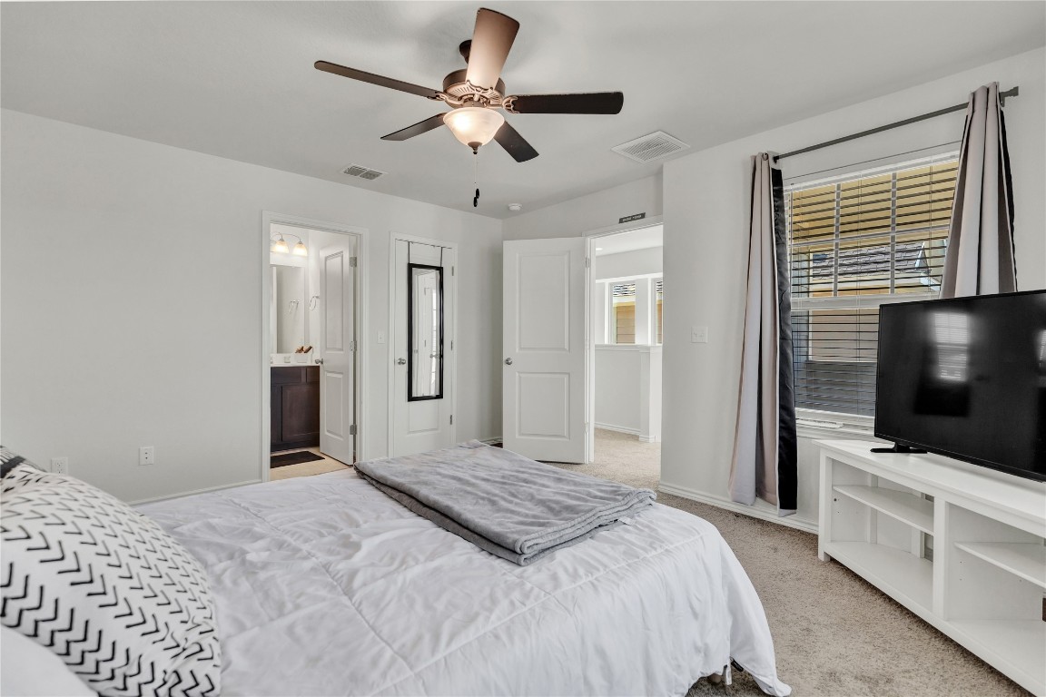 380 Witchhazel Way San Marcos, TX 78666 - Photo 14 of 22 a bedroom with a bed and a flat screen tv