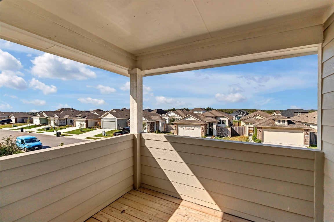380 Witchhazel Way San Marcos, TX 78666 - Photo 16 of 22 a view of a balcony with wooden floor