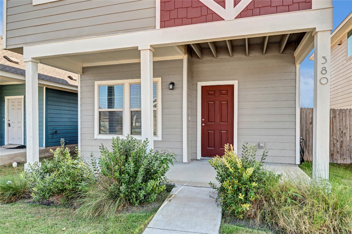 380 Witchhazel Way San Marcos, TX 78666 - Photo 2 of 22 front view of the house with potted plants