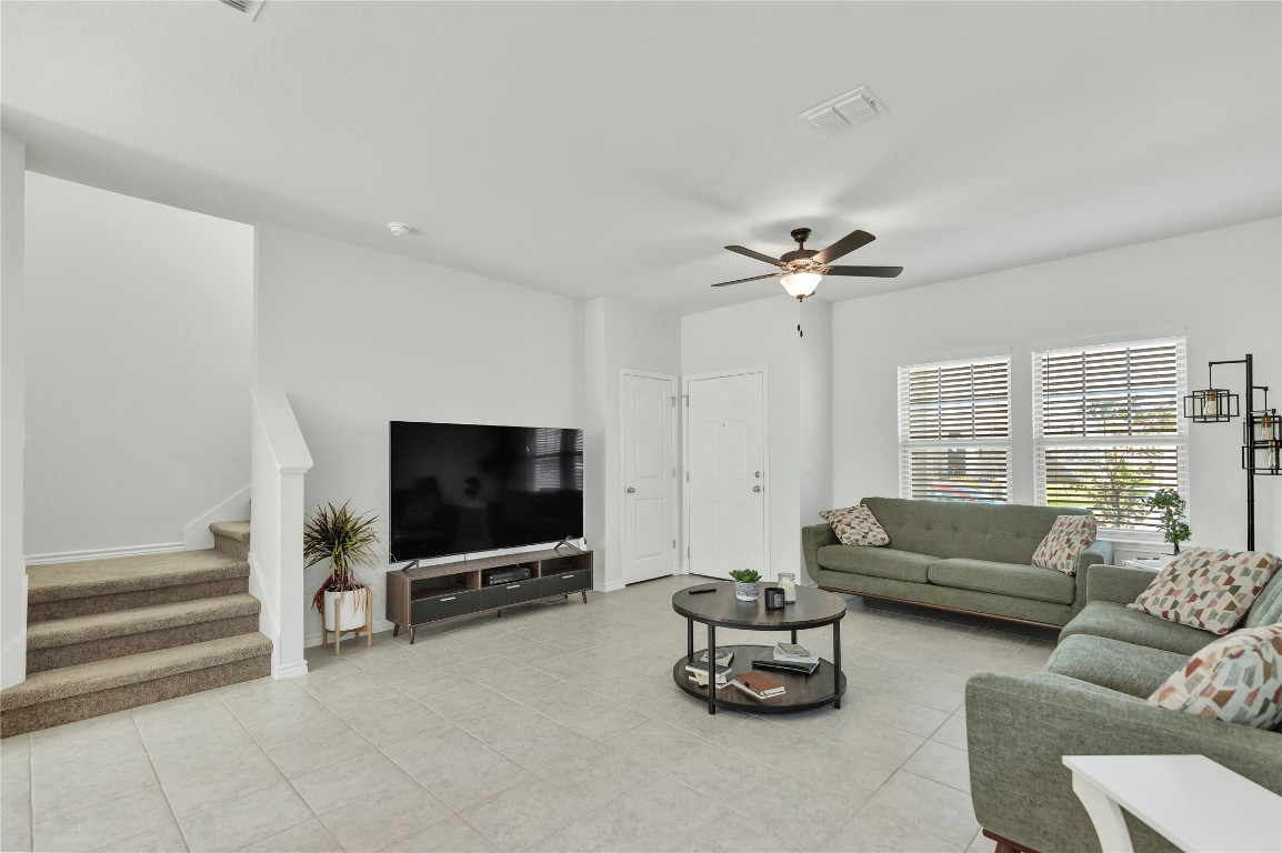 380 Witchhazel Way San Marcos, TX 78666 - Photo 5 of 22 a living room with furniture gym equipment and a flat screen tv