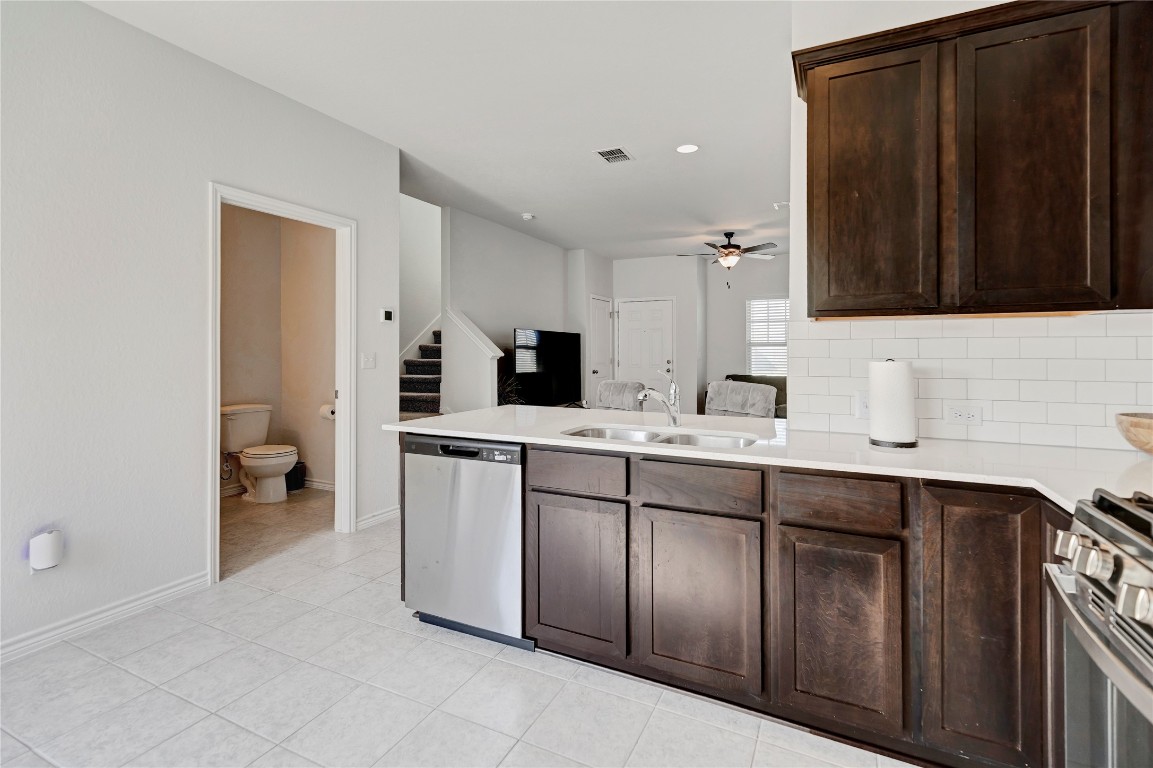 380 Witchhazel Way San Marcos, TX 78666 - Photo 22 of 22 a kitchen with a sink and cabinets