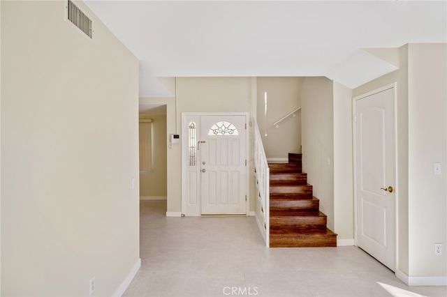 a view of entryway with stairs