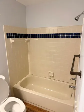 a bathroom with a shower and a bathtub