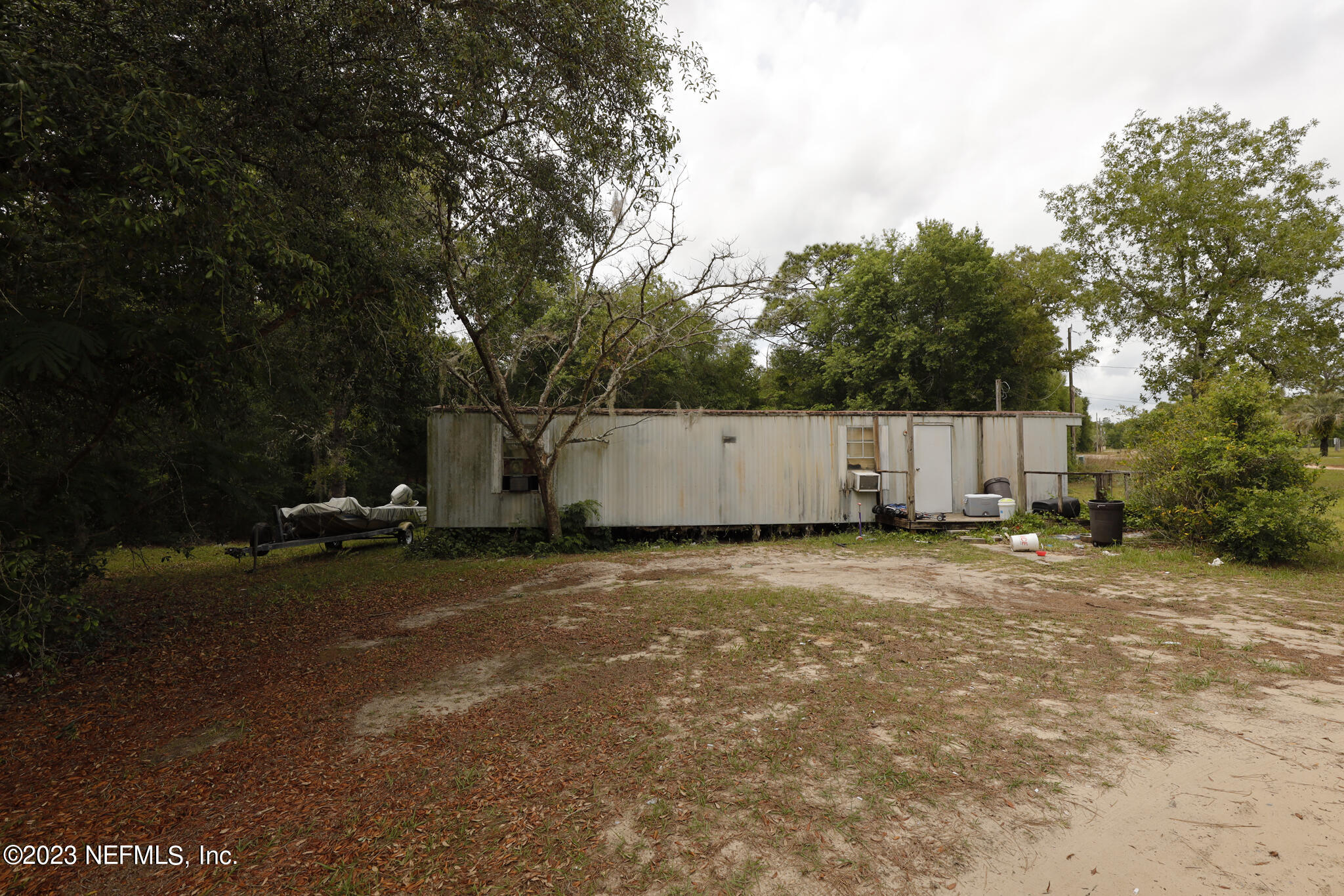 7354 Yale Street Keystone Heights, FL 32656 - Photo 12 of 13 a backyard of a house and trees