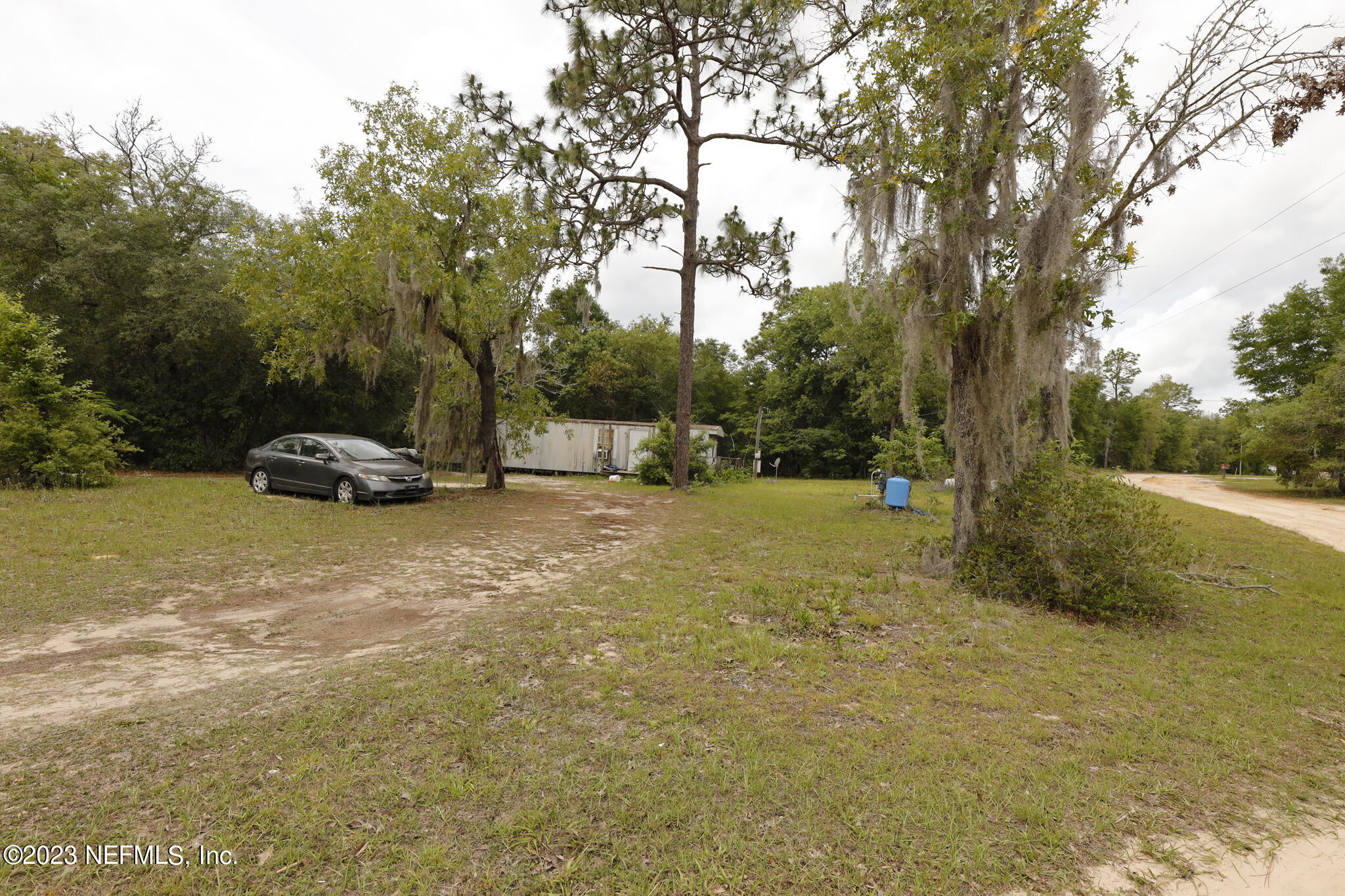 7354 Yale Street Keystone Heights, FL 32656 - Photo 9 of 13 a view of a yard with a car parked