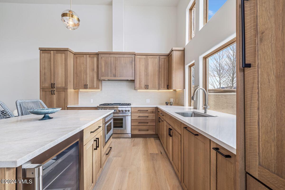 751 Singletree Road, Unit 1 Edwards, CO 81632 - Photo 11 of 33 a kitchen with a sink stove and cabinets