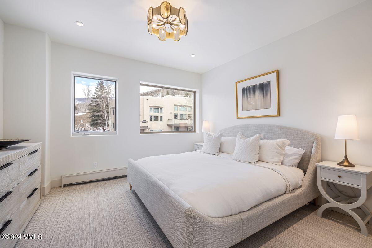 751 Singletree Road, Unit 1 Edwards, CO 81632 - Photo 13 of 33 a bedroom with a bed and a night stand