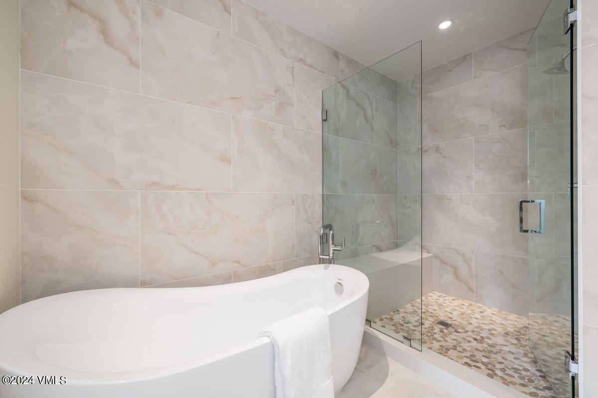 751 Singletree Road, Unit 1 Edwards, CO 81632 - Photo 16 of 33 a bathroom with a bathtub and shower