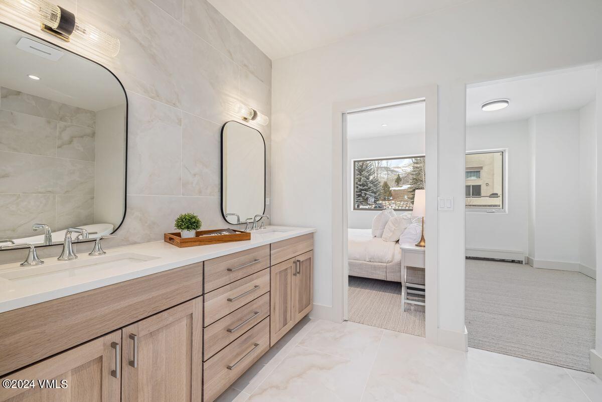 751 Singletree Road, Unit 1 Edwards, CO 81632 - Photo 17 of 33 a spacious bathroom with double sink and a mirror