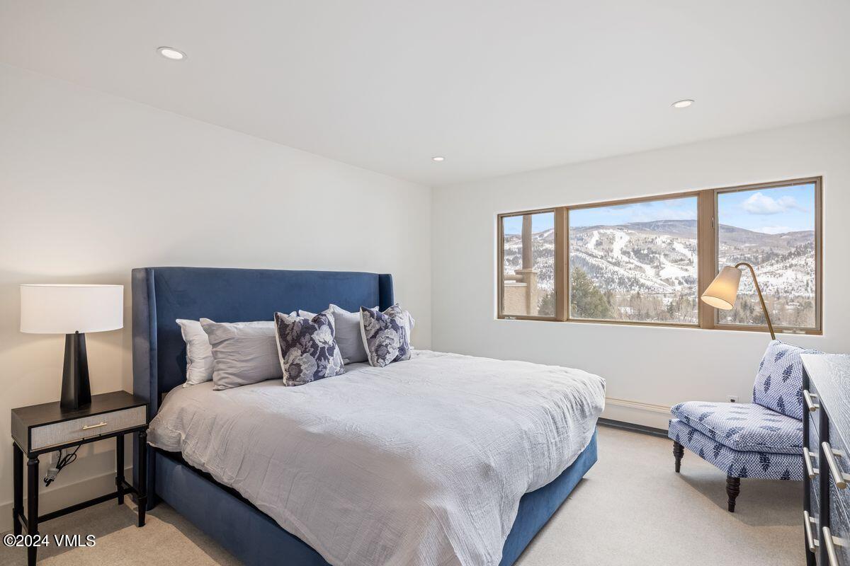 751 Singletree Road, Unit 1 Edwards, CO 81632 - Photo 22 of 33 a bedroom with a bed and window