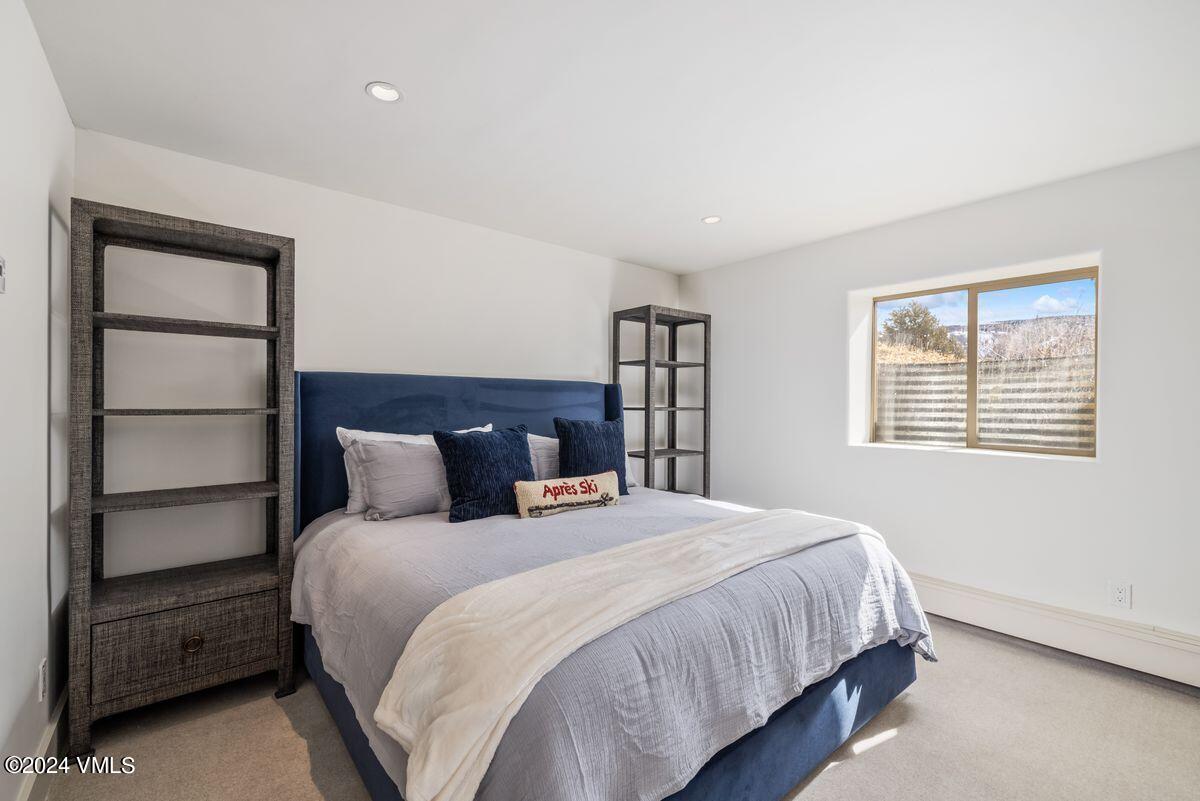 751 Singletree Road, Unit 1 Edwards, CO 81632 - Photo 26 of 33 a bedroom with a bed and a window