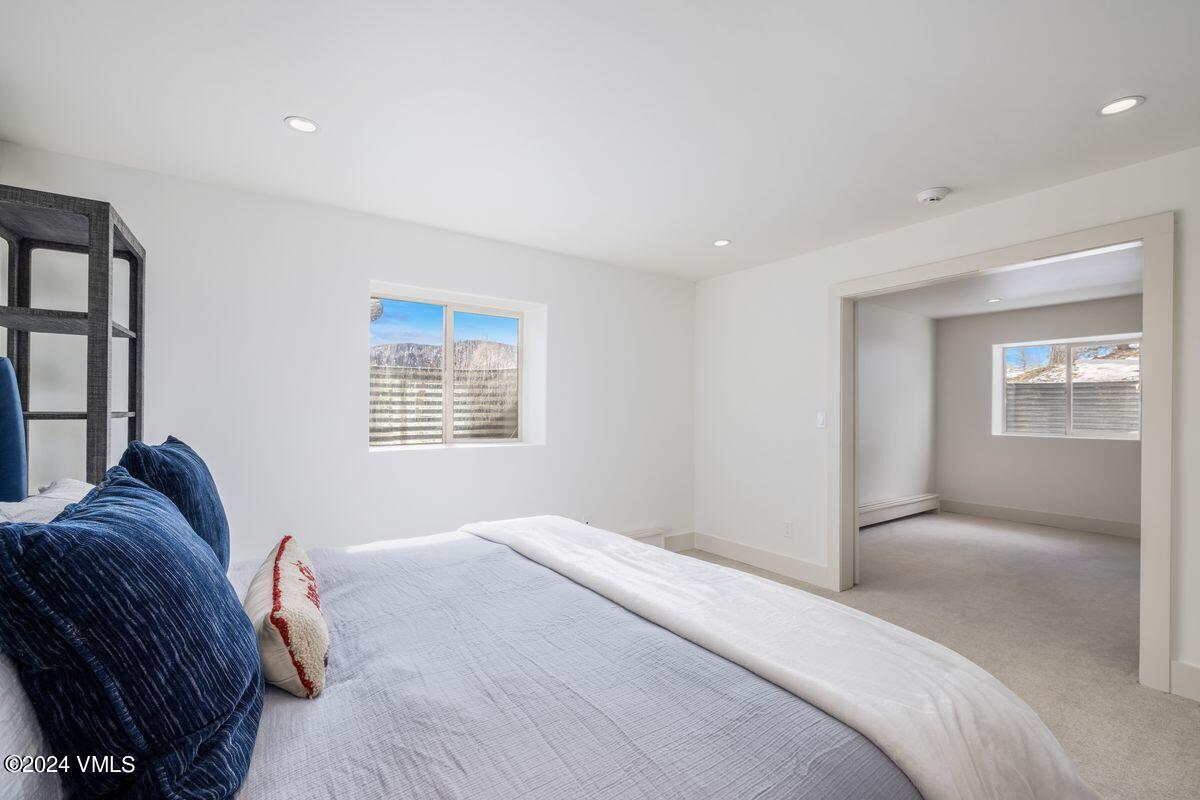 751 Singletree Road, Unit 1 Edwards, CO 81632 - Photo 27 of 33 a bedroom with a bed and a window