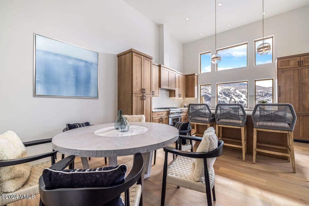 751 Singletree Road, Unit 1 Edwards, CO 81632 - Photo 6 of 33 a view of a dining room with furniture window and wooden floor