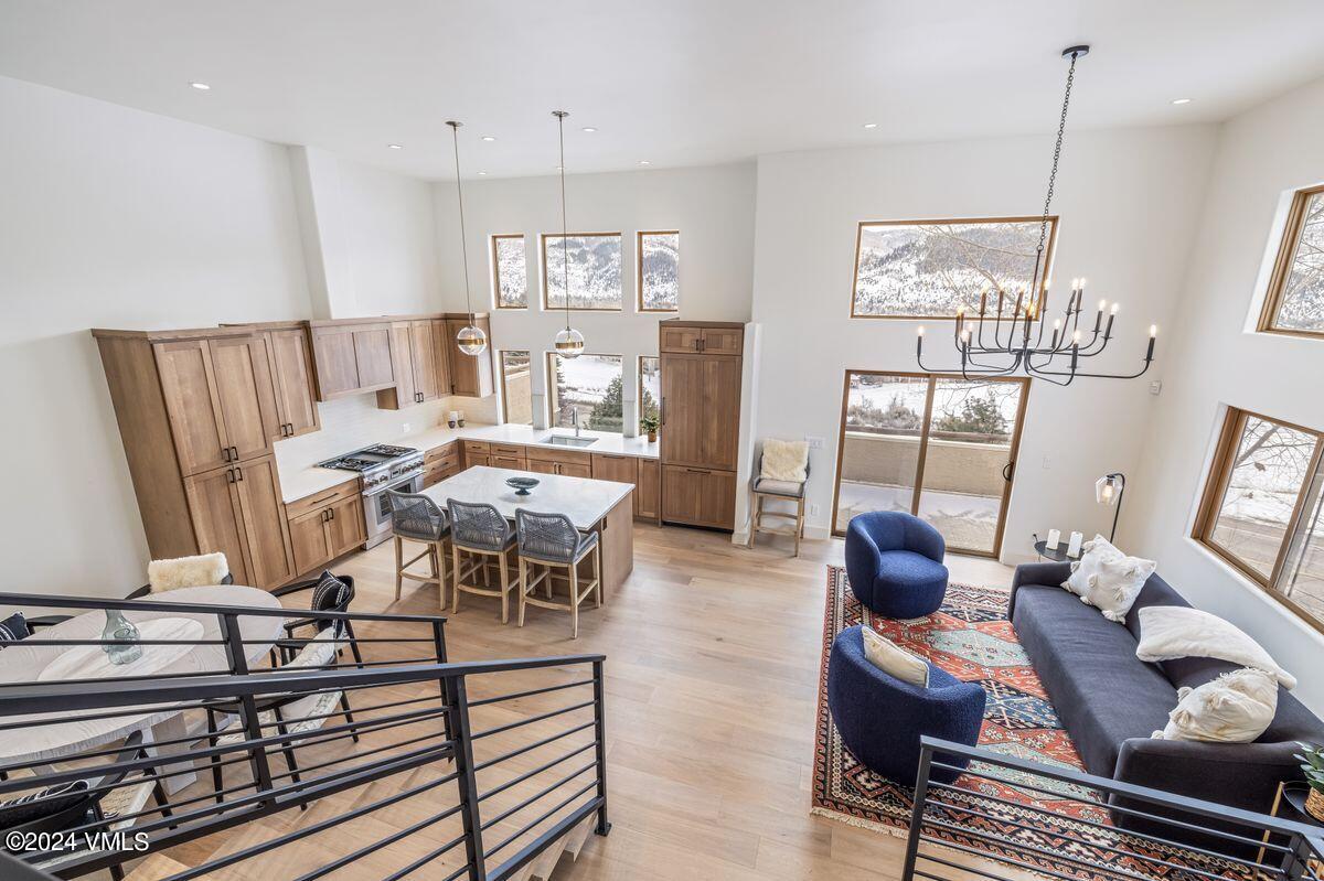 751 Singletree Road, Unit 1 Edwards, CO 81632 - Photo 7 of 33 a living room with furniture a rug and white walls