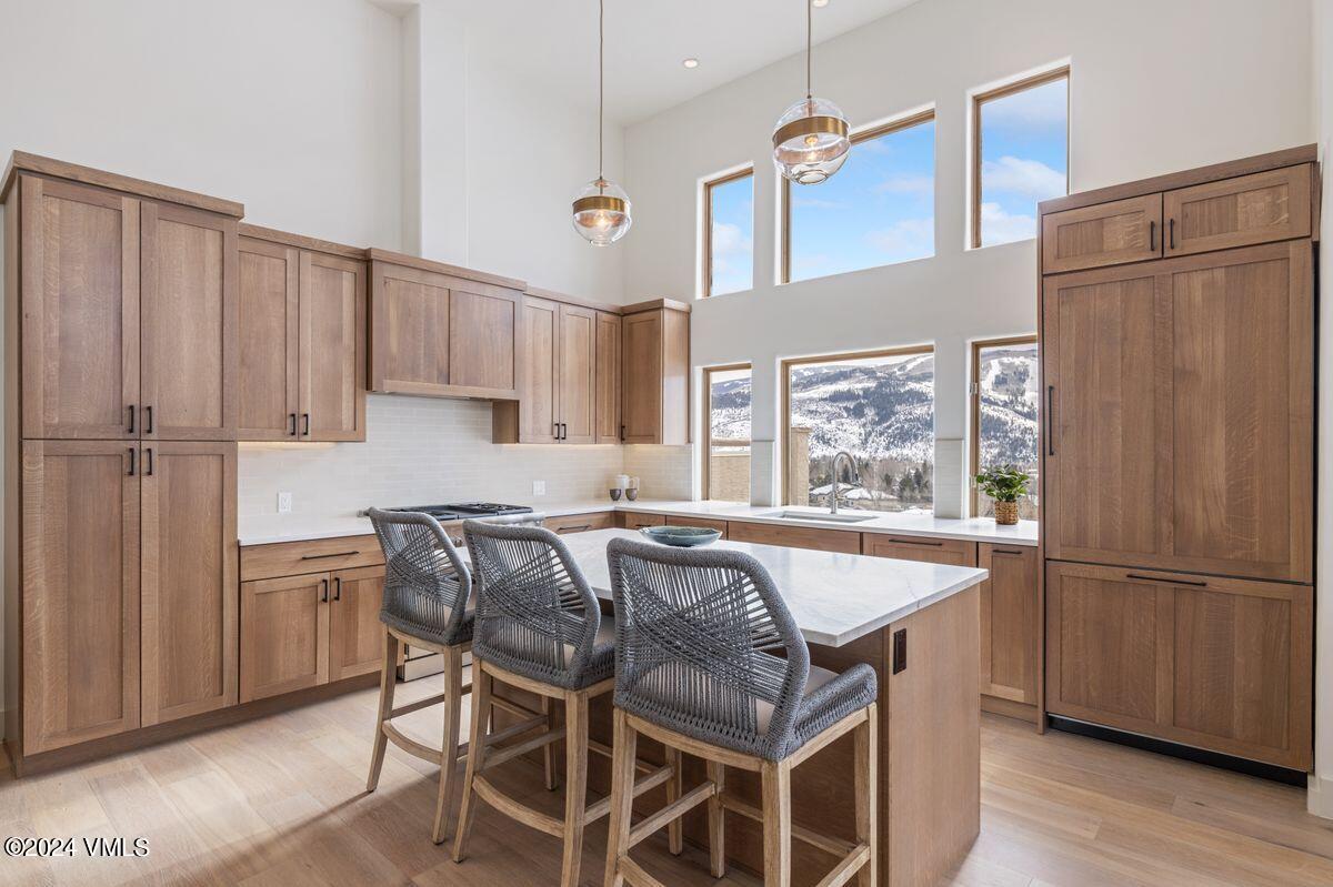 751 Singletree Road, Unit 1 Edwards, CO 81632 - Photo 9 of 33 a kitchen with stainless steel appliances granite countertop a refrigerator a sink dishwasher a stove and a refrigerator with wooden floor