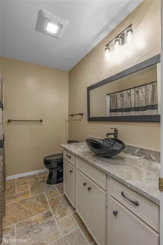 a view of room with window and bathroom