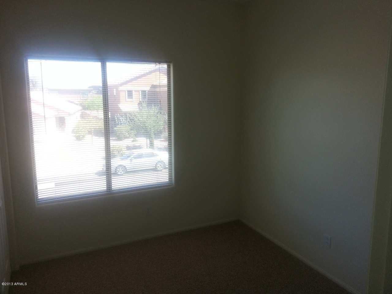 44395 Cypress Lane Maricopa, AZ 85138 - Photo 14 of 20 an empty room with a window
