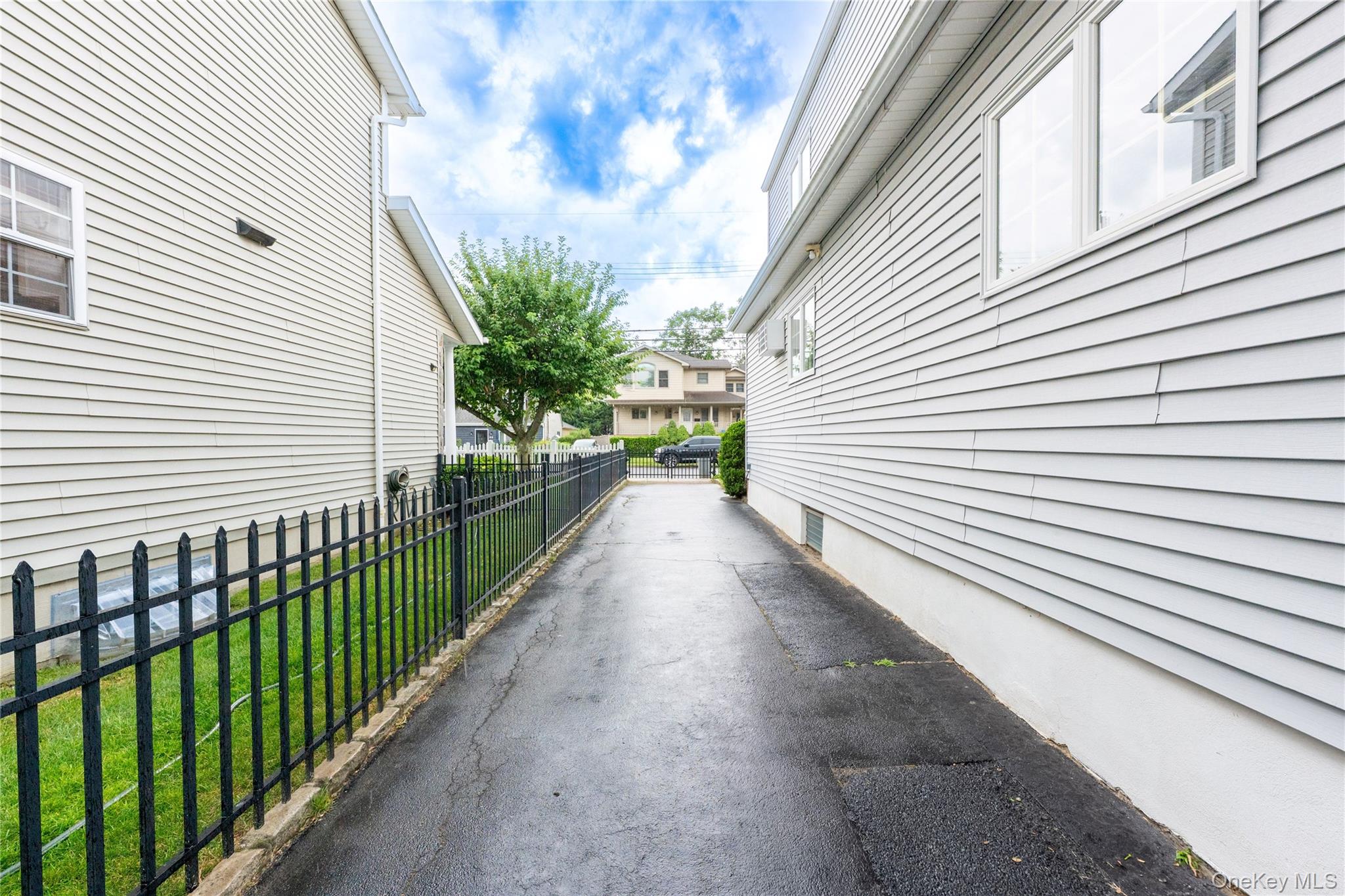 54 Edgewood Road Port Washington, NY 11050 - Photo 25 of 25 Long fenced in driveway