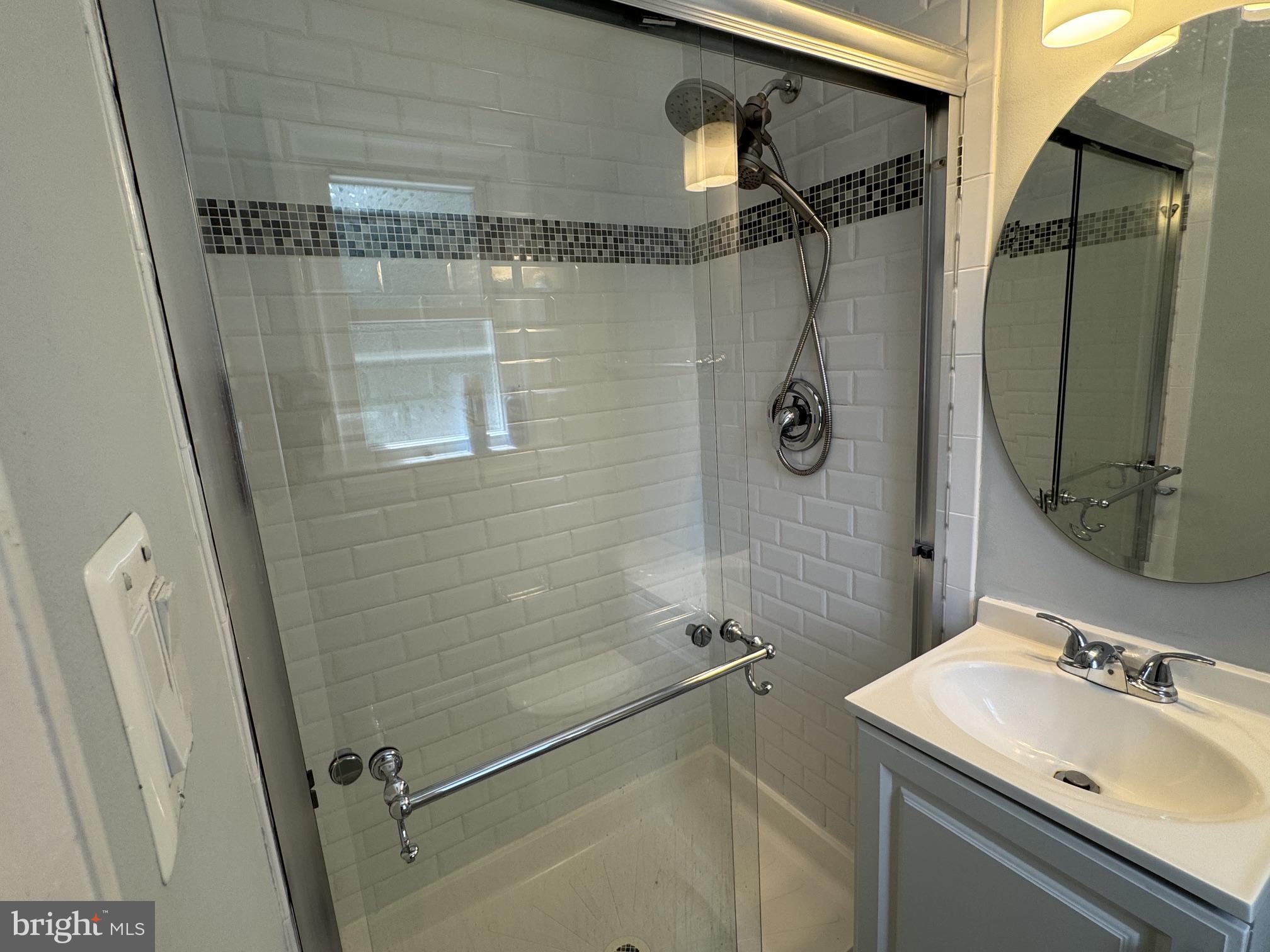 6603 Huntsman Boulevard Springfield, VA 22152 - Photo 24 of 64 Sleek modern bathroom oasis.