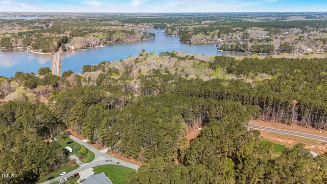 an aerial view of residential building with outdoor space and lake view