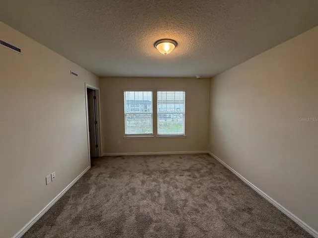 a bathroom with a shower and toilet