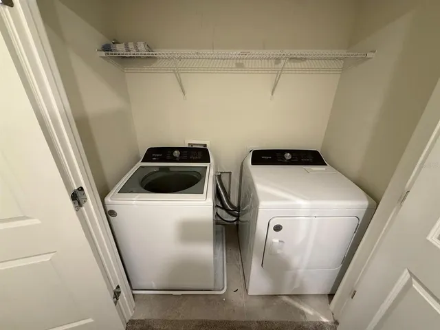 an empty room with a empty space and windows