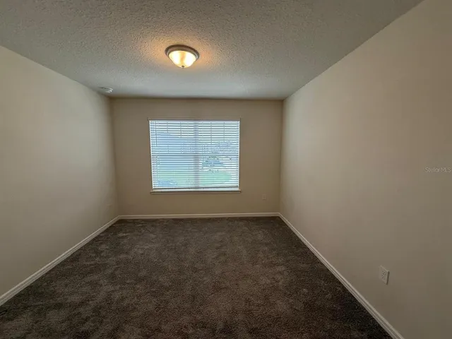 a white toilet sitting next to a bath tub