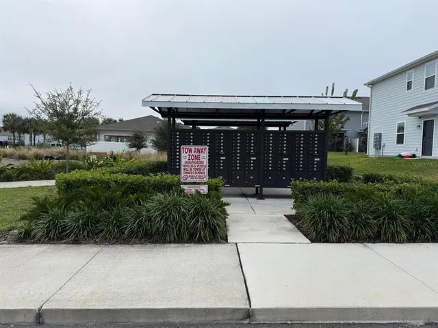a view of swimming pool with outdoor seating and yard in the back