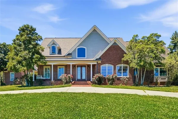 front view of a house with a yard