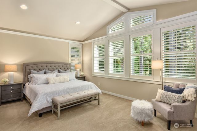 a bedroom with a bed and a couch