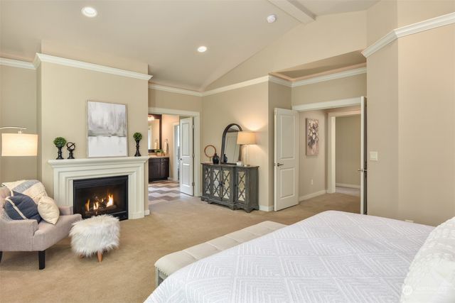 a bedroom with a bed and a fireplace