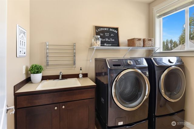 a utility room with dryer and washer