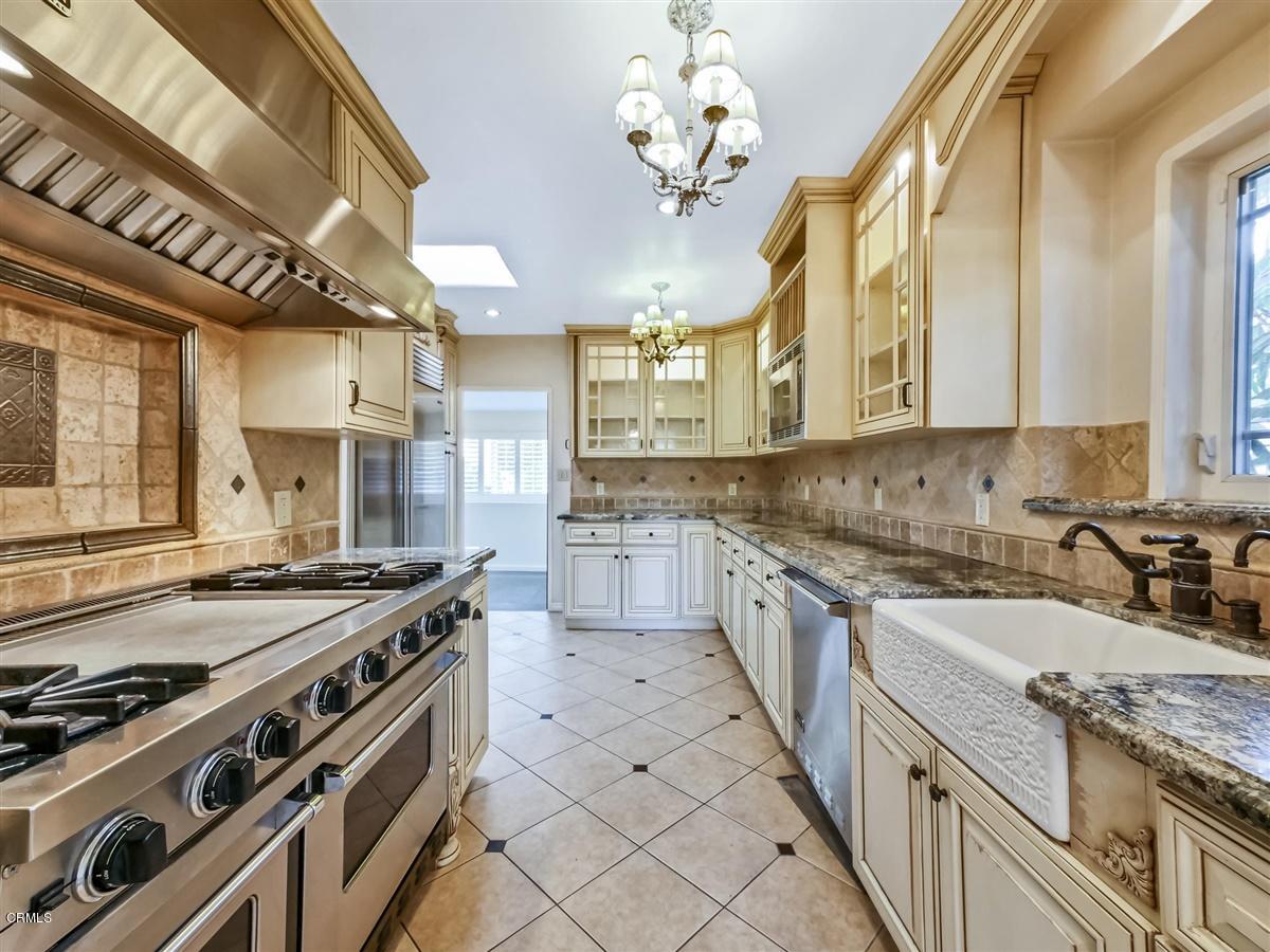 1501 Broadview Drive Glendale, CA 91208 - Photo 13 of 39 a kitchen with stainless steel appliances granite countertop a stove and a sink