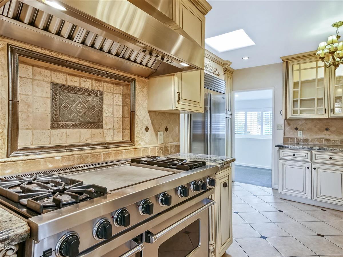 1501 Broadview Drive Glendale, CA 91208 - Photo 14 of 39 a kitchen with stainless steel appliances granite countertop a stove and a sink