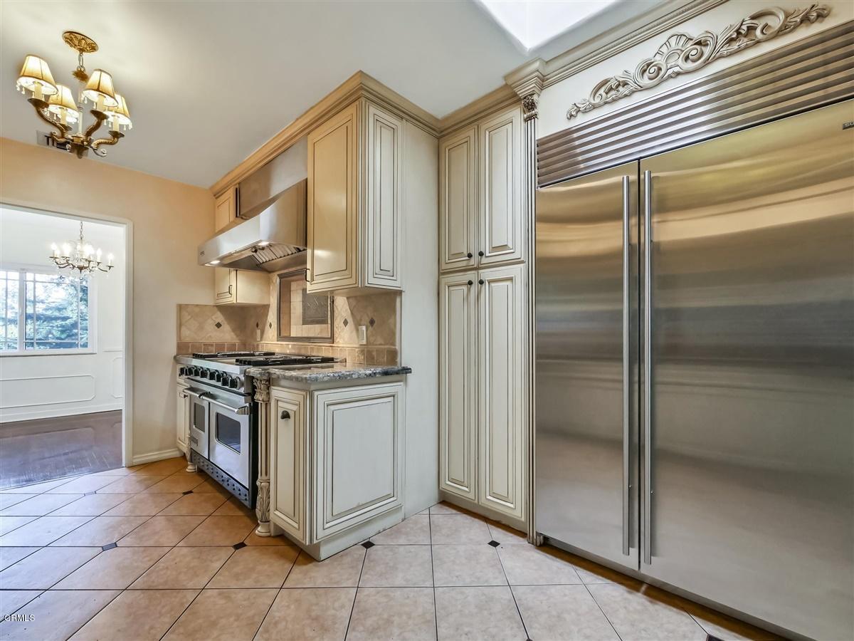 1501 Broadview Drive Glendale, CA 91208 - Photo 16 of 39 a kitchen with stainless steel appliances granite countertop a granite counter tops and a refrigerator