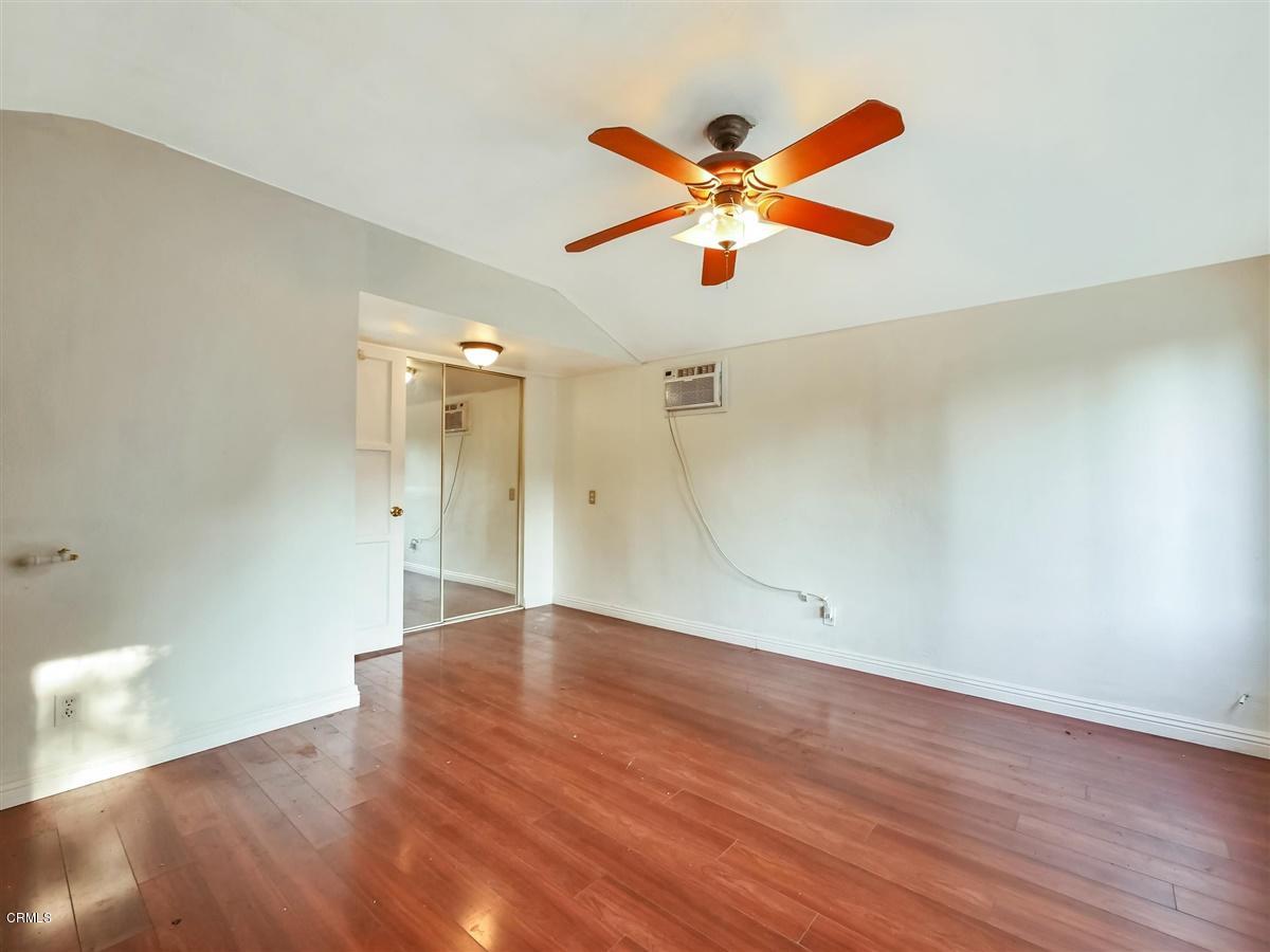 1501 Broadview Drive Glendale, CA 91208 - Photo 30 of 39 an empty room with wooden floor fan and a ceiling fan