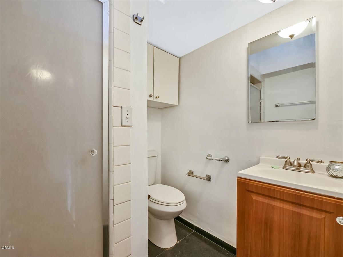 1501 Broadview Drive Glendale, CA 91208 - Photo 33 of 39 a bathroom with a toilet sink and mirror