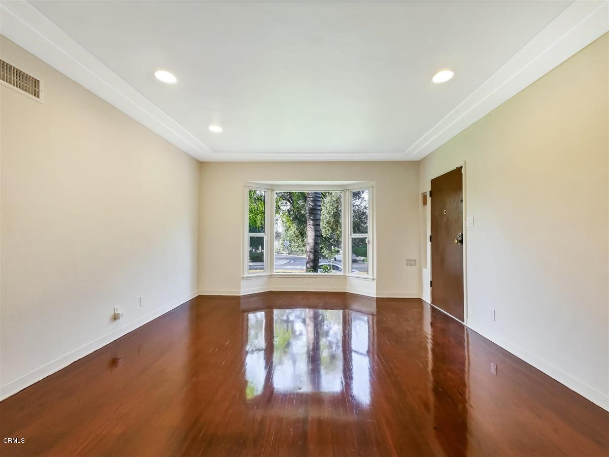 1501 Broadview Drive Glendale, CA 91208 - Photo 9 of 39 an empty room with wooden floor and windows