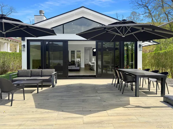 a view of a brick house with a outdoor space