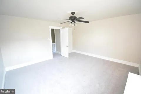 view of a room with a ceiling fan