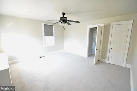 view of walk in closet with window