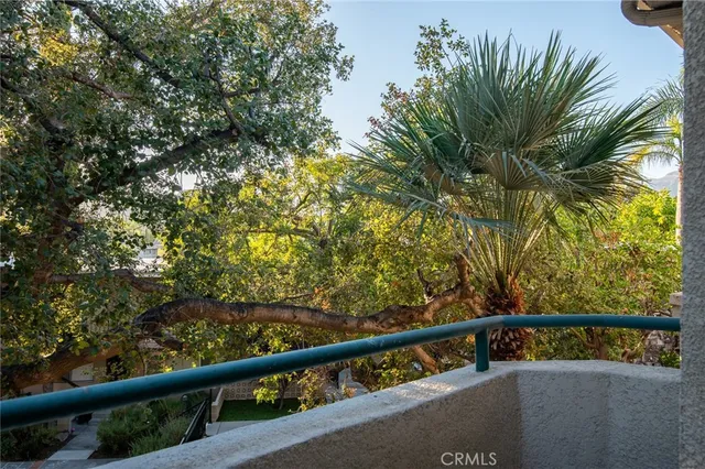 a view of balcony with a tree