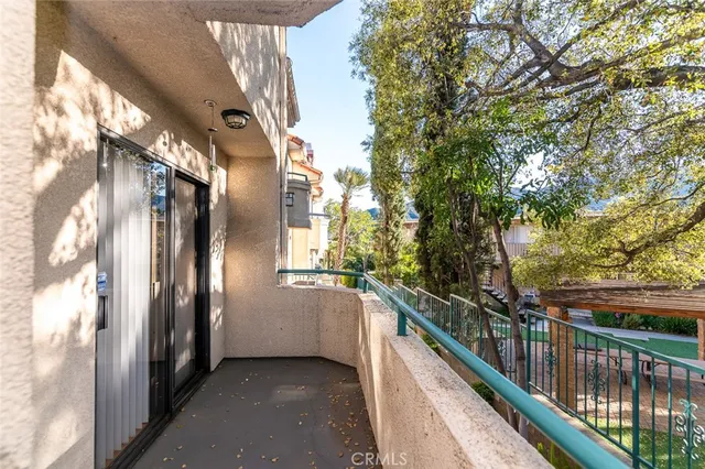 a view of kitchen and a refrigerator stove