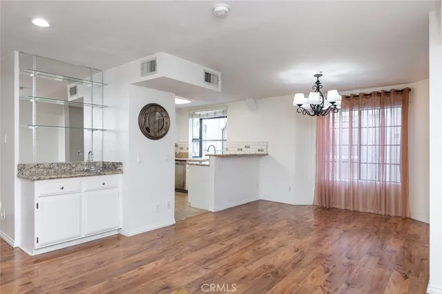 a view of a kitchen with wooden floor
