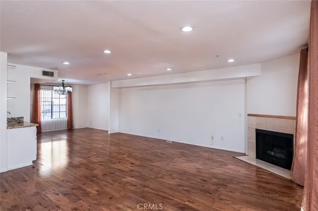 a view of a kitchen with a sink and a stove top oven