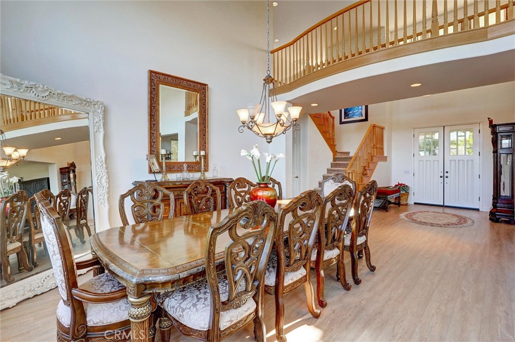 14079 Stagecoach Trail Moorpark, CA 93021 - Photo 12 of 47 a view of a dining room with furniture and wooden floor