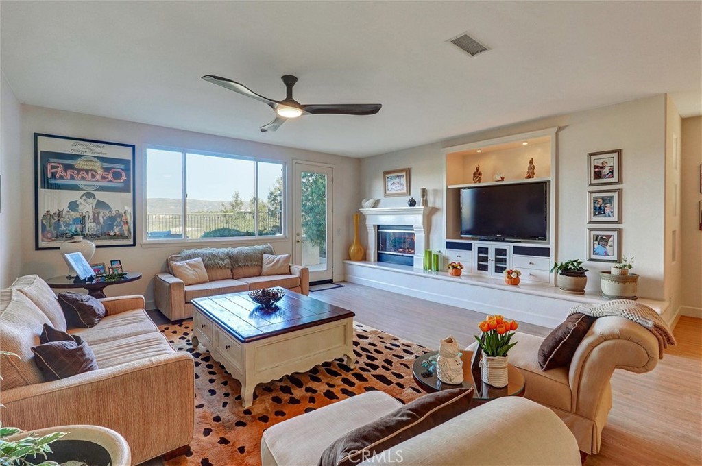 14079 Stagecoach Trail Moorpark, CA 93021 - Photo 13 of 47 a living room with furniture and a flat screen tv