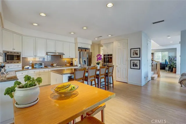 a view of kitchen with dining table and chairs