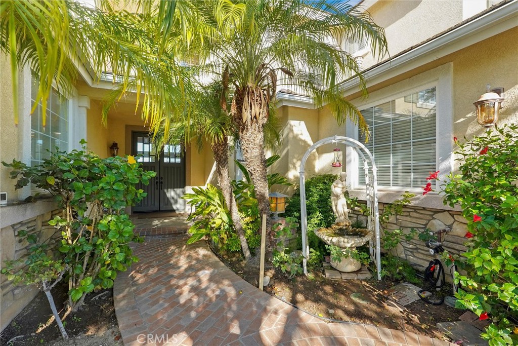 14079 Stagecoach Trail Moorpark, CA 93021 - Photo 2 of 47 a front view of a house with a garden