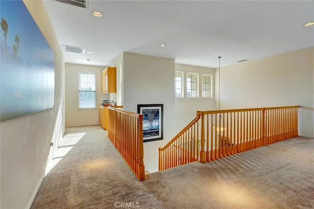 a view of a hallway with windows